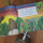 Kinderbuch "Kiki der Kiwi" (zweisprachig, Softcover) und gehäkeltes Kuscheltier Kiki.